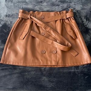 Brown leather skirt.
